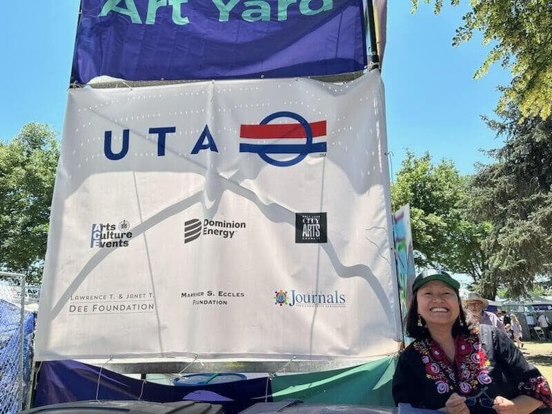 Charis next to a Utah Transit Authority (UTA) banner.